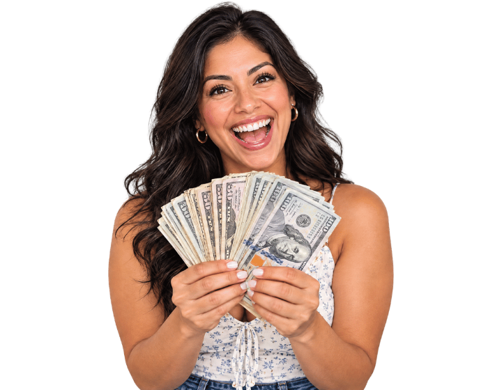 Happy customer holding cash after selling their car